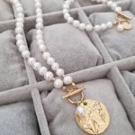 Necklace with medallion and pearl bracelet set