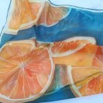 100% silk scarf decorated with orange prints