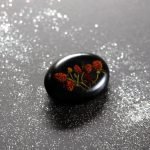 Black handmade brooch with strawberries
