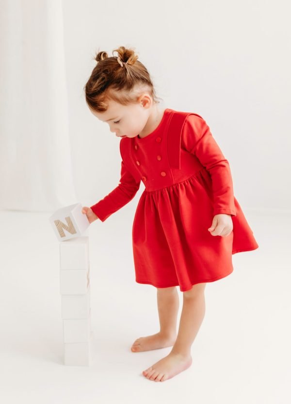 Red long-sleeved dress for a girl