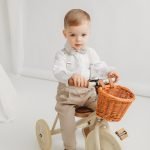 Christening costume with patterned shoulder straps and bowtie