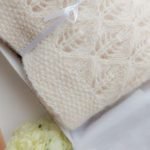 Lightweight, soft, hand-knitted baby blanket